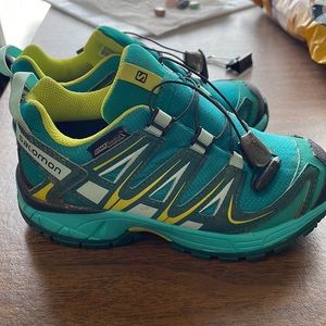 Kids size 11 Salomon shoes.